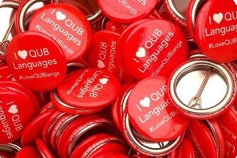 Red badges with I love QUB Languages message